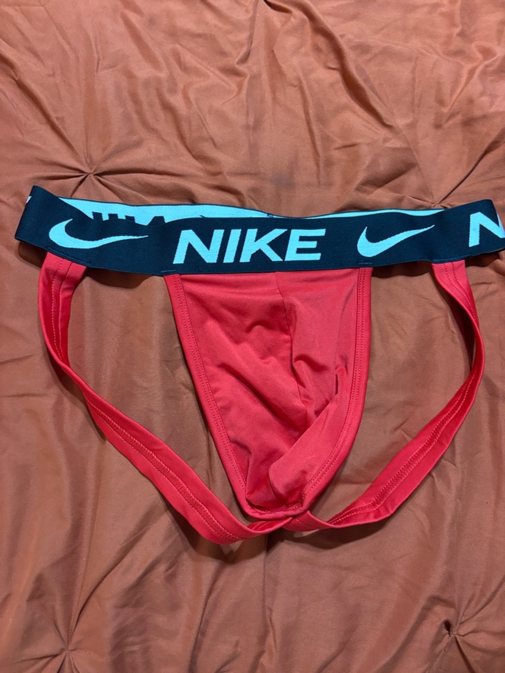 Nike Red Jockstrap with Black Waistband and Light Blue Logo